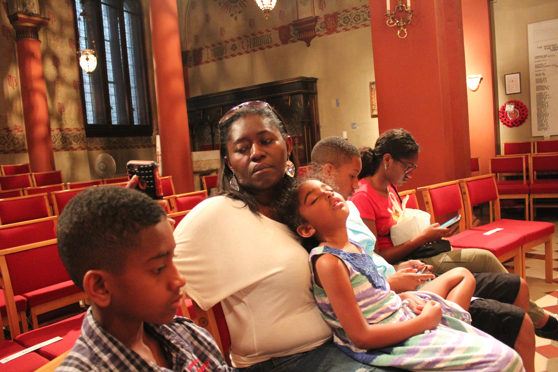 Tony's family resting inside a beautiful Italian church — real travel with kids