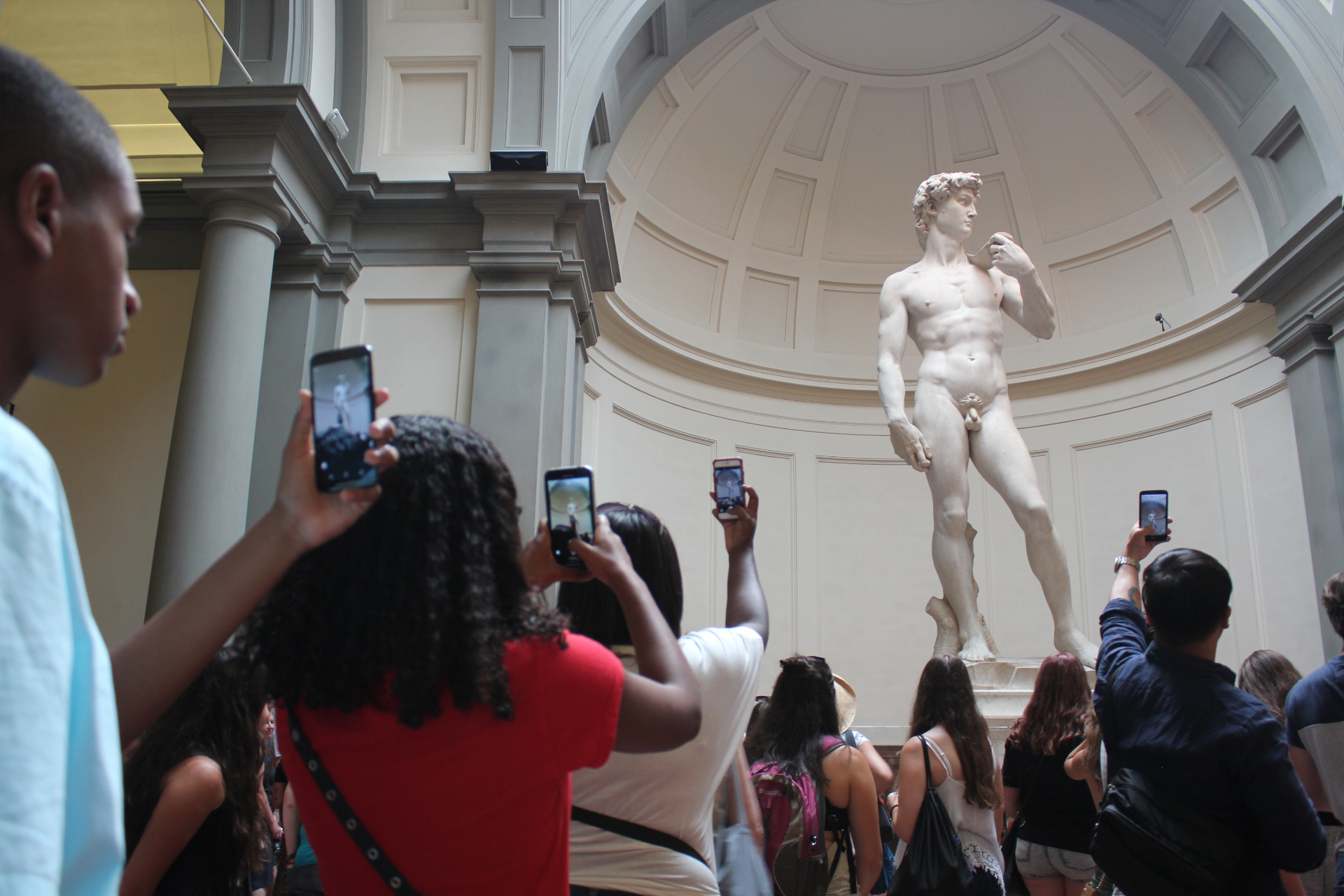 Tony's family photographing Michelangelo's David at the Galleria dell'Accademia in Florence