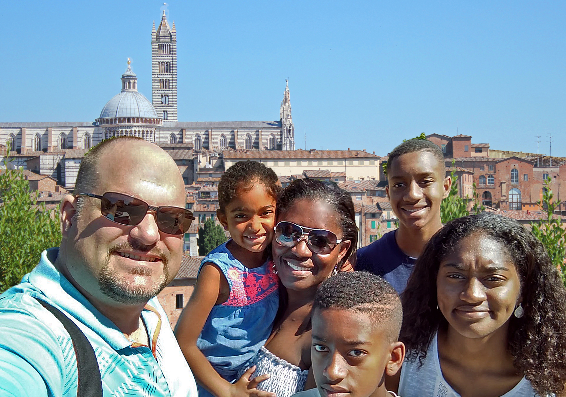 Tony's family posing in front of the Siena Cathedral in Tuscany, Italy