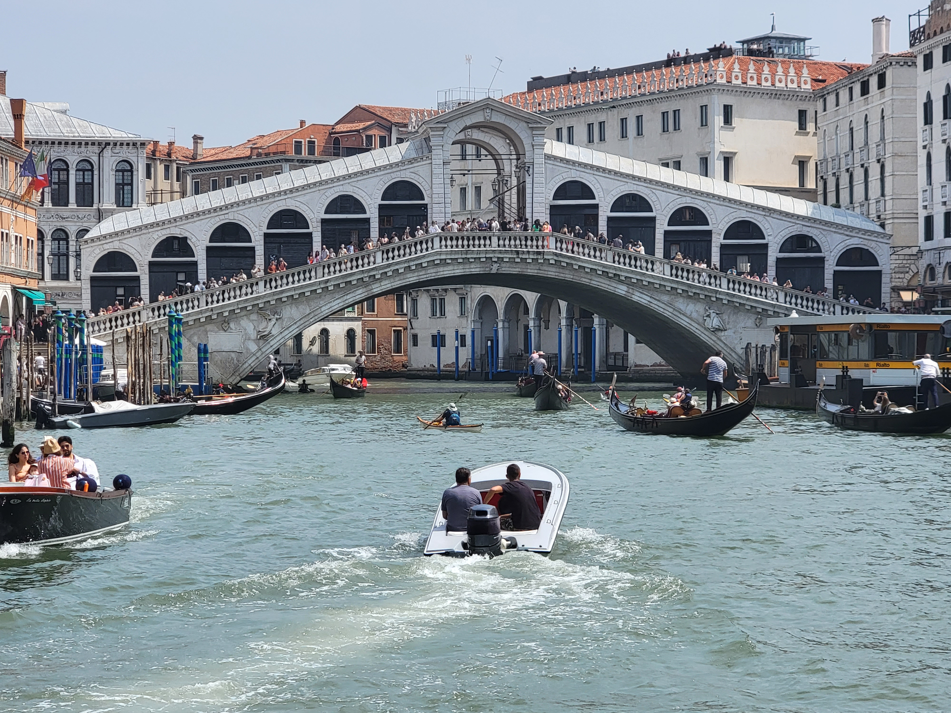 Venice's Rialto Bridge on a sunny day — the kind of place you don't want to drag a heavy suitcase