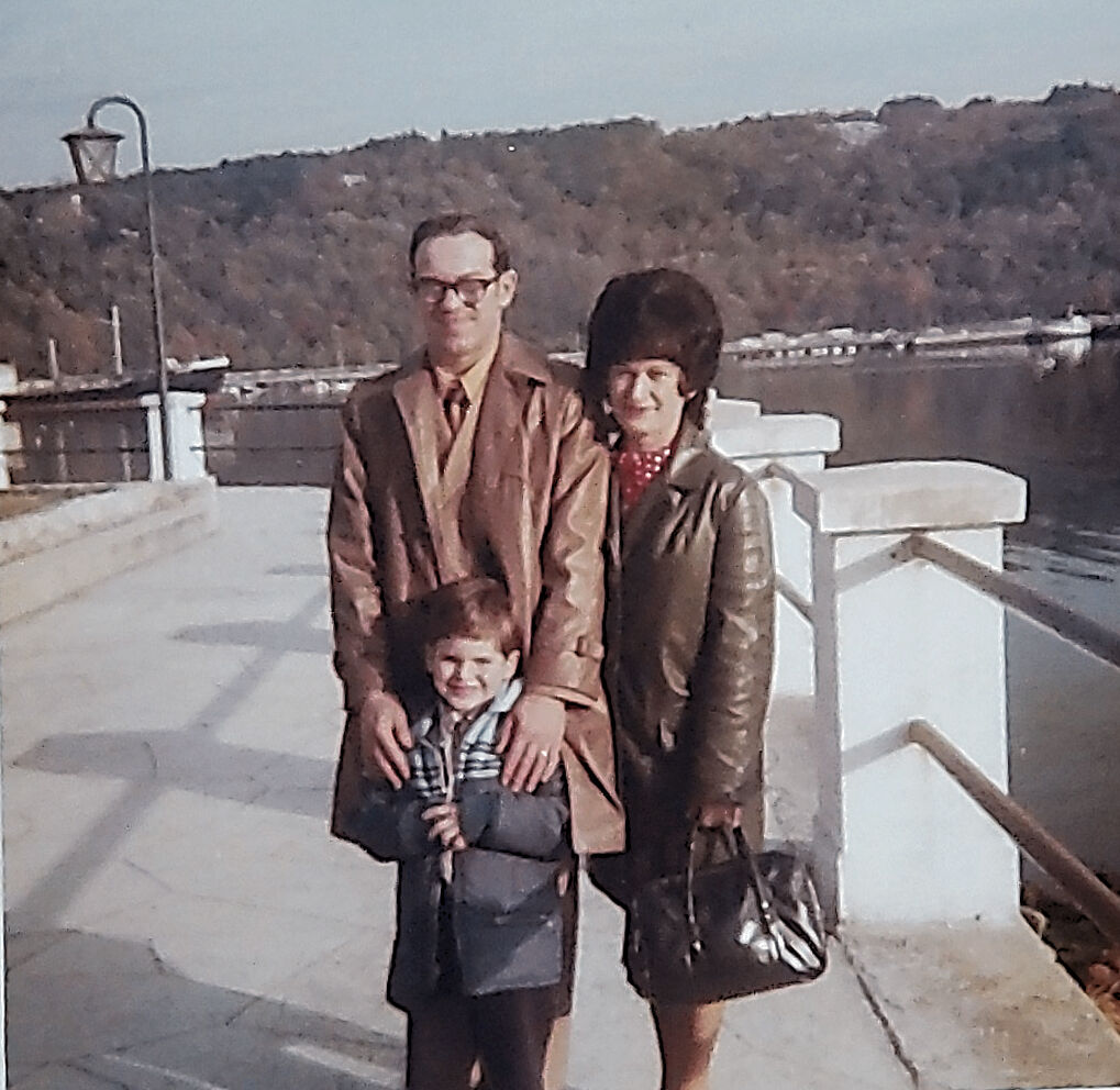Young Tony with parents on a European bridge