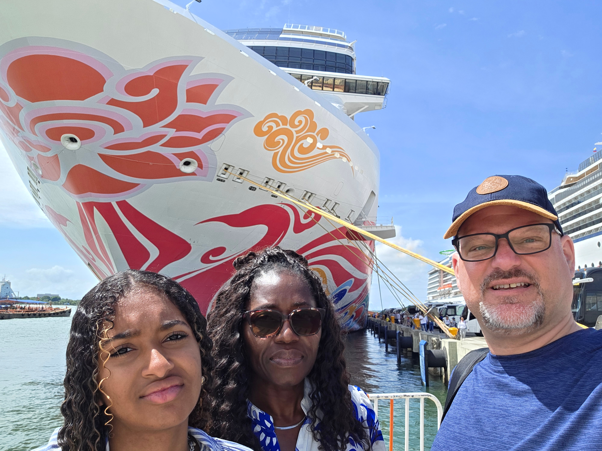 Family selfie in front of the cruise ship