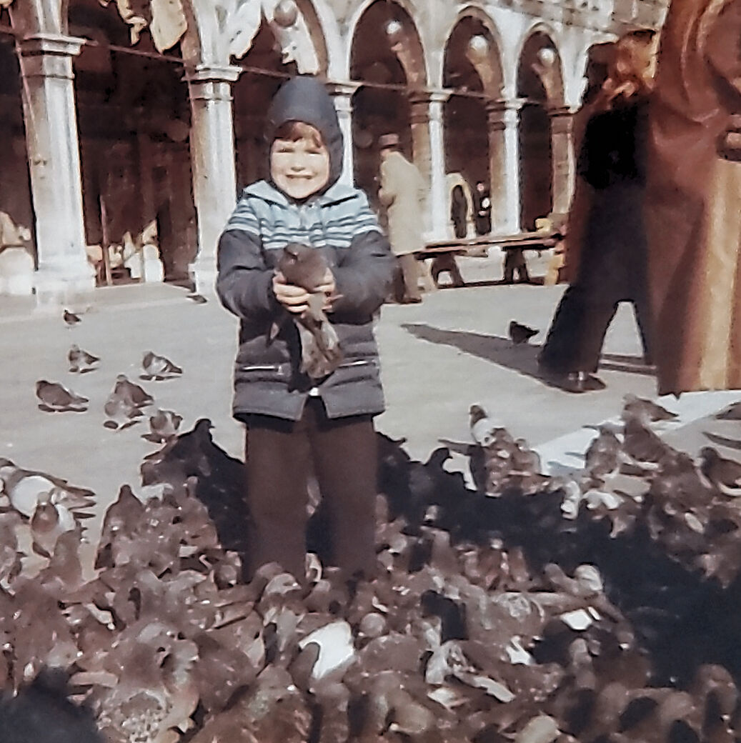 Young Tony with pigeons in Venice